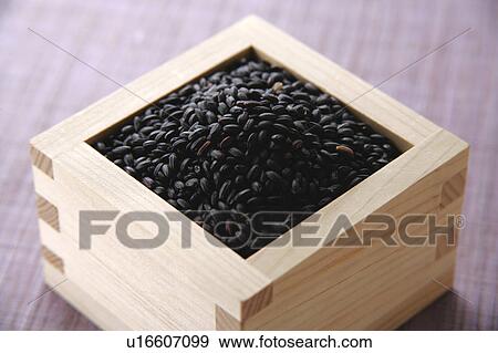 Uncooked black rice in a cup View Large Photo Image Stock Photo - Uncooked black rice in a cup. Fotosearch