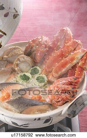 Stock Image - Boiled seafood in pot. Fotosearch