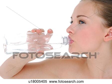 Close-up of a young woman drinking water from a water bottle View Large Photo Image Stock Photography - Close-up of a young woman drinking water from a water bottle. Fotosearch
