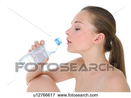 Stock Photo - Side profile of a young woman drinking water from a water bottle. Fotosearch