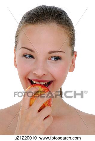 Close-up of a young woman eating an apple View Large Photo Image Stock Image - Close-up of a young woman eating an apple. Fotosearch