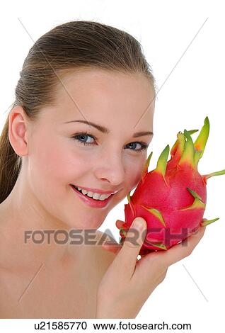 Close-up of a young woman holding a pitaya fruit and smiling View Large Photo Image Stock Image - Close-up of a young woman holding a pitaya fruit and smiling. Fotosearch