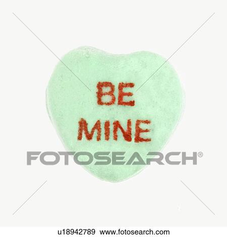 Green candy heart that reads be mine against white background. View Large Photo Image Stock Photo - Green candy heart that reads be mine against white background.. Fotosearch