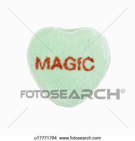 Green candy heart that reads magic against white background. View Large Photo Image Picture - Green candy heart that reads magic against white background.. Fotosearch