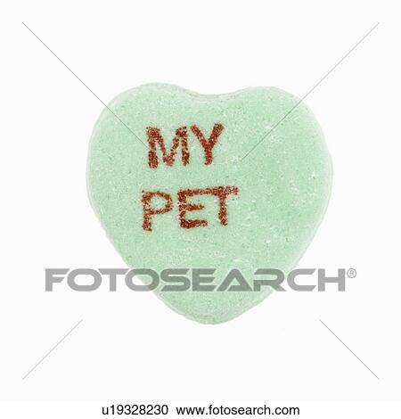 Stock Image - Green candy heart that reads my pet against white background.. Fotosearch