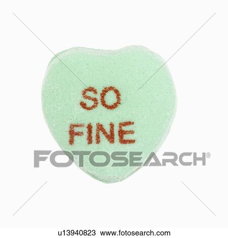 Stock Image - Green candy heart that reads so fine against white background.. Fotosearch
