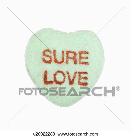 Stock Photo - Green candy heart that reads sure love against white background.. Fotosearch