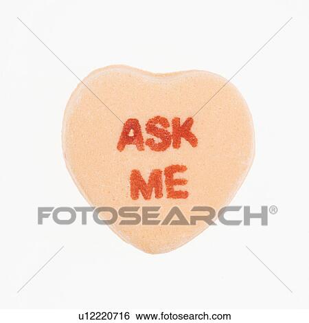 Orange candy heart that reads ask me against white background. View Large Photo Image Stock Photograph - Orange candy heart that reads ask me against white background.. Fotosearch
