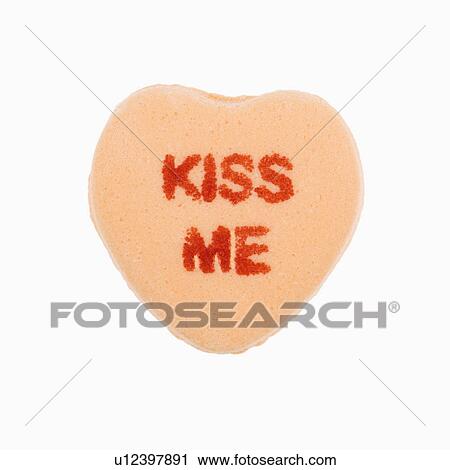 Orange candy heart that reads kiss me against white background. View Large Photo Image Stock Image - Orange candy heart that reads kiss me against white background.. Fotosearch