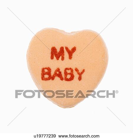Orange candy heart that reads my baby against white background. View Large Photo Image Stock Photo - Orange candy heart that reads my baby against white background.. Fotosearch
