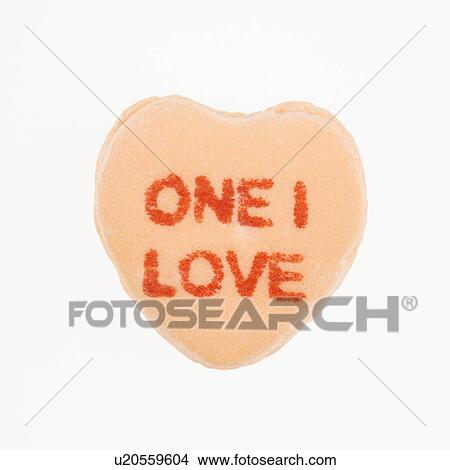 Picture - Orange candy heart that reads one I love against white background.. Fotosearch