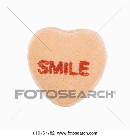 Orange candy heart that reads smile against white background. View Large Photo Image Stock Image - Orange candy heart that reads smile against white background.. Fotosearch
