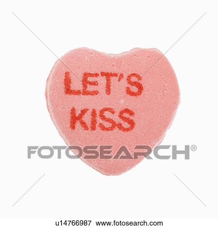 Pink candy heart that reads lets kiss against white background. View Large Photo Image Stock Photo - Pink candy heart that reads lets kiss against white background.. Fotosearch