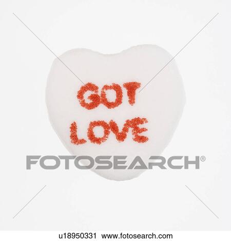 Stock Image - White candy heart that reads got love against white background.. Fotosearch