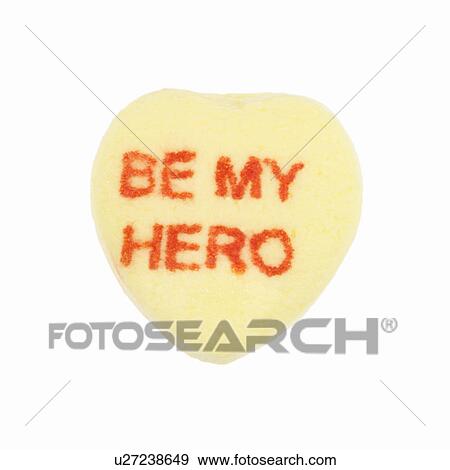 Stock Photo - Yellow candy heart that reads be my hero against white background.. Fotosearch