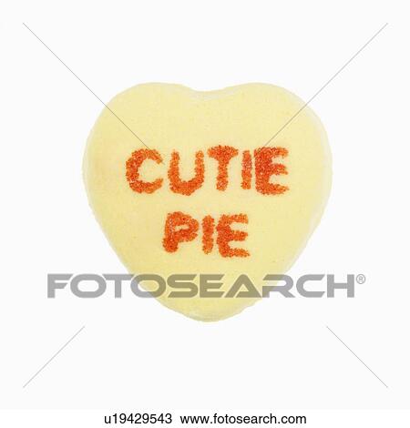 Yellow candy heart that reads cutie pie against white background. View Large Photo Image Stock Image - Yellow candy heart that reads cutie pie against white background.. Fotosearch