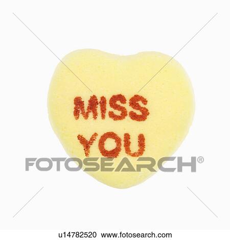 Yellow candy heart that reads miss you against white background. View Large Photo Image Stock Image - Yellow candy heart that reads miss you against white background.. Fotosearch