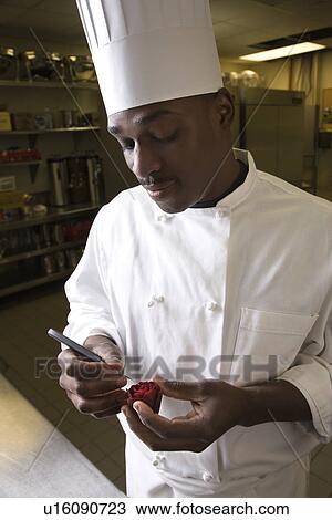 African-American male chef carving a red beet into a rose. View Large Photo Image Stock Image - African-American male chef carving a red beet into a rose.. Fotosearch