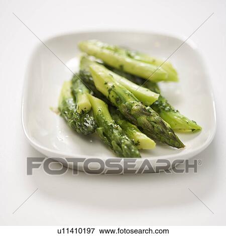 Stock Photo - Plate of green cooked asparagus.. Fotosearch
