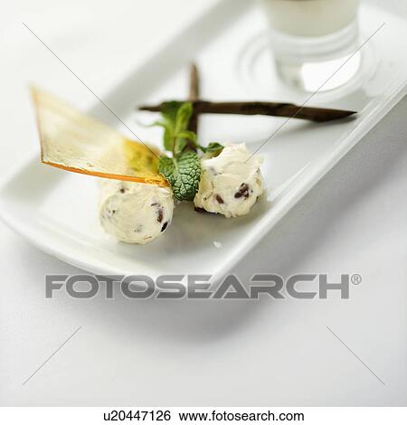 Stock Photograph - Still life of gourmet dessert with professional presentation.. Fotosearch