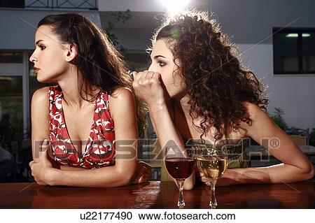 Two women in a bar View Large Photo Image Stock Image - Two women in a bar. Fotosearch