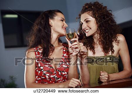 Stock Photo - Two women in a bar. Fotosearch