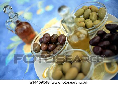 Stock Photo - Assortment of olives with oil and vinegar. Fotosearch