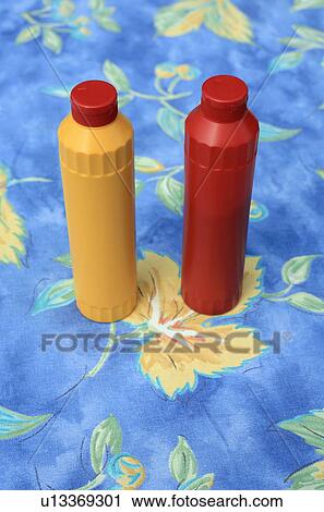 Stock Image - Bottles of ketchup and mustard. Fotosearch