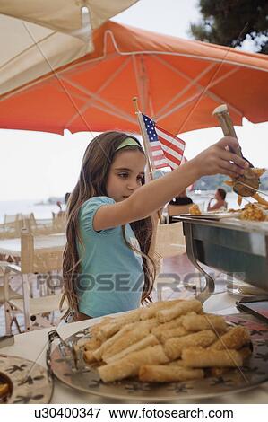 Girl at buffet View Large Photo Image Stock Photo - Girl at buffet. Fotosearch
