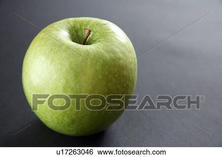 Granny Smith apple, black background View Large Photo Image Stock Photograph - Granny Smith apple, black background. Fotosearch