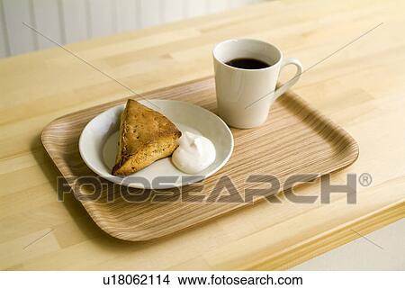 Picture - Coffee and cake on tray. Fotosearch