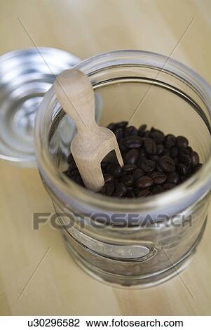 Coffee beans in glass jar View Large Photo Image Stock Image - Coffee beans in glass jar. Fotosearch