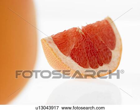 Blood Orange with slice cut out View Large Photo Image Stock Photo - Blood Orange with slice cut out. Fotosearch