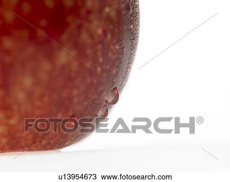 Stock Image - One Apple with dew on it. Fotosearch