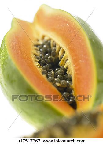 One Papaya with a slice cut out View Large Photo Image Stock Photo - One Papaya with a slice cut out. Fotosearch