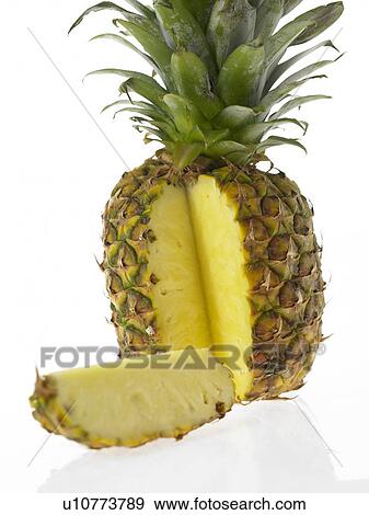 Stock Photo - One Pineapple with a slice cut out. Fotosearch