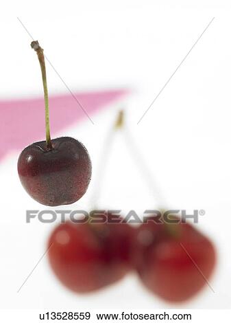 Stock Photo - Three red cherries. Fotosearch