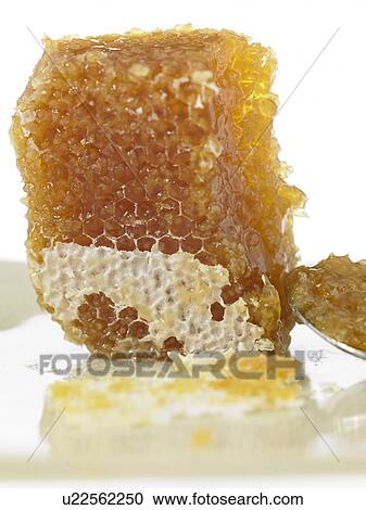 Stock Image - Raw foods honey comb. Fotosearch