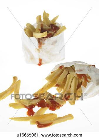 Stock Image - French fried Chips and Tomato Sauce in take out packaging. Fotosearch