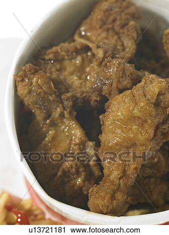 Fried chicken and chips View Large Photo Image Stock Image - Fried chicken and chips. Fotosearch