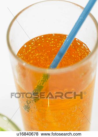 Glass of fizzy drink with straw View Large Photo Image Stock Photo - Glass of fizzy drink with straw. Fotosearch
