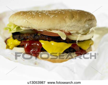 One Beef burger with toppings View Large Photo Image Stock Photo - One Beef burger with toppings. Fotosearch