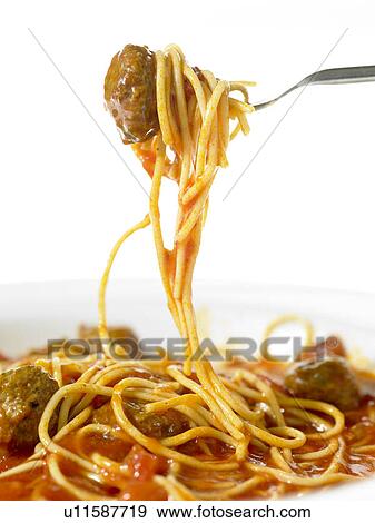 Stock Photo - Spaghetti and meatballs on a fork. Fotosearch