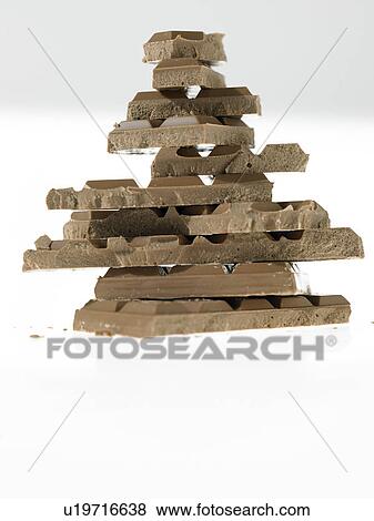Stacked pieces of chocolate View Large Photo Image Stock Photo - Stacked pieces of chocolate. Fotosearch