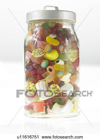 Stock Image - Sweets and candies in a jar. Fotosearch