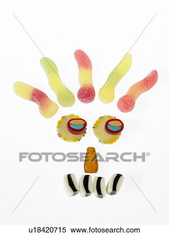 Stock Photography - Sweets placed to make a face. Fotosearch