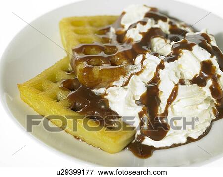 Stock Photo - Waffles with whipped Cream and chocolate. Fotosearch