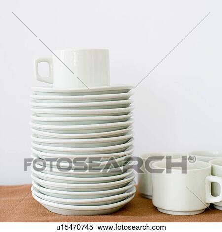 Close-up of a stack of saucers with cups View Large Photo Image Stock Photography - Close-up of a stack of saucers with cups. Fotosearch