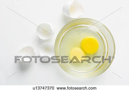 Close-up of egg yolks in a glass bowl View Large Photo Image Stock Image - Close-up of egg yolks in a glass bowl. Fotosearch