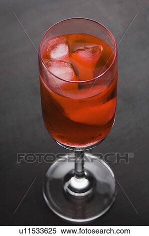 Close-up of ice cubes in a glass of cocktail View Large Photo Image Stock Photography - Close-up of ice cubes in a glass of cocktail. Fotosearch